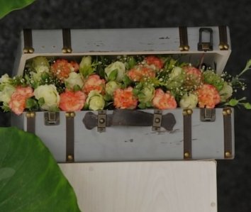 Vintage-style trunk box of roses and carnations
