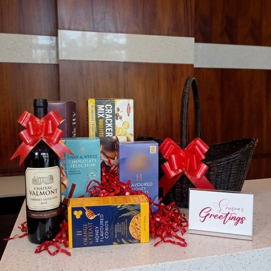 Black wicker gift basket with cabernet sauvignon, chocolates and cookies